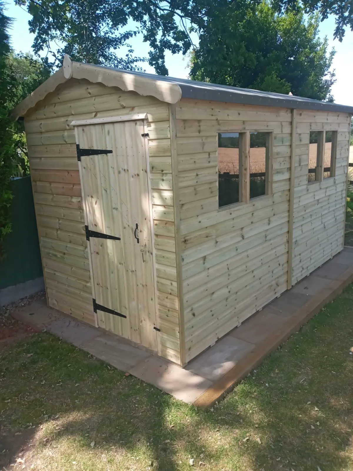 Treated tongue and groove cladding boards fitted to a timber building