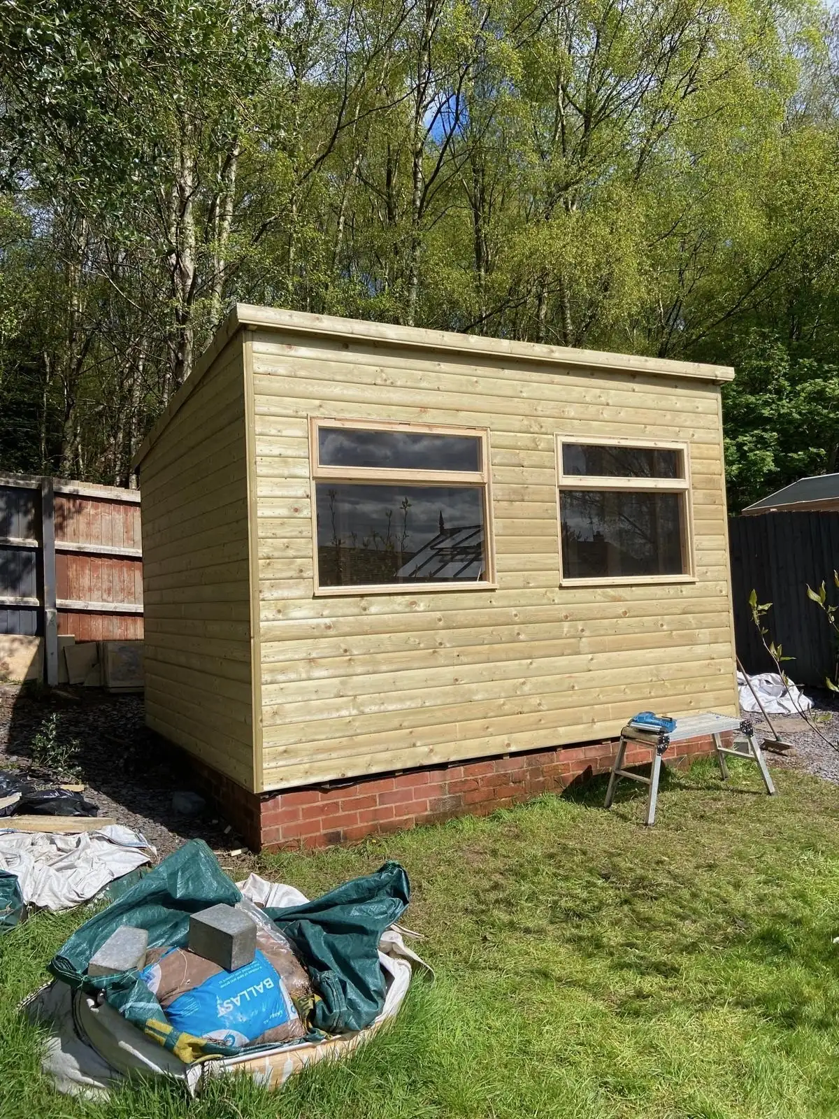 Pent-roof garden room with wide windows, lined for year-round use