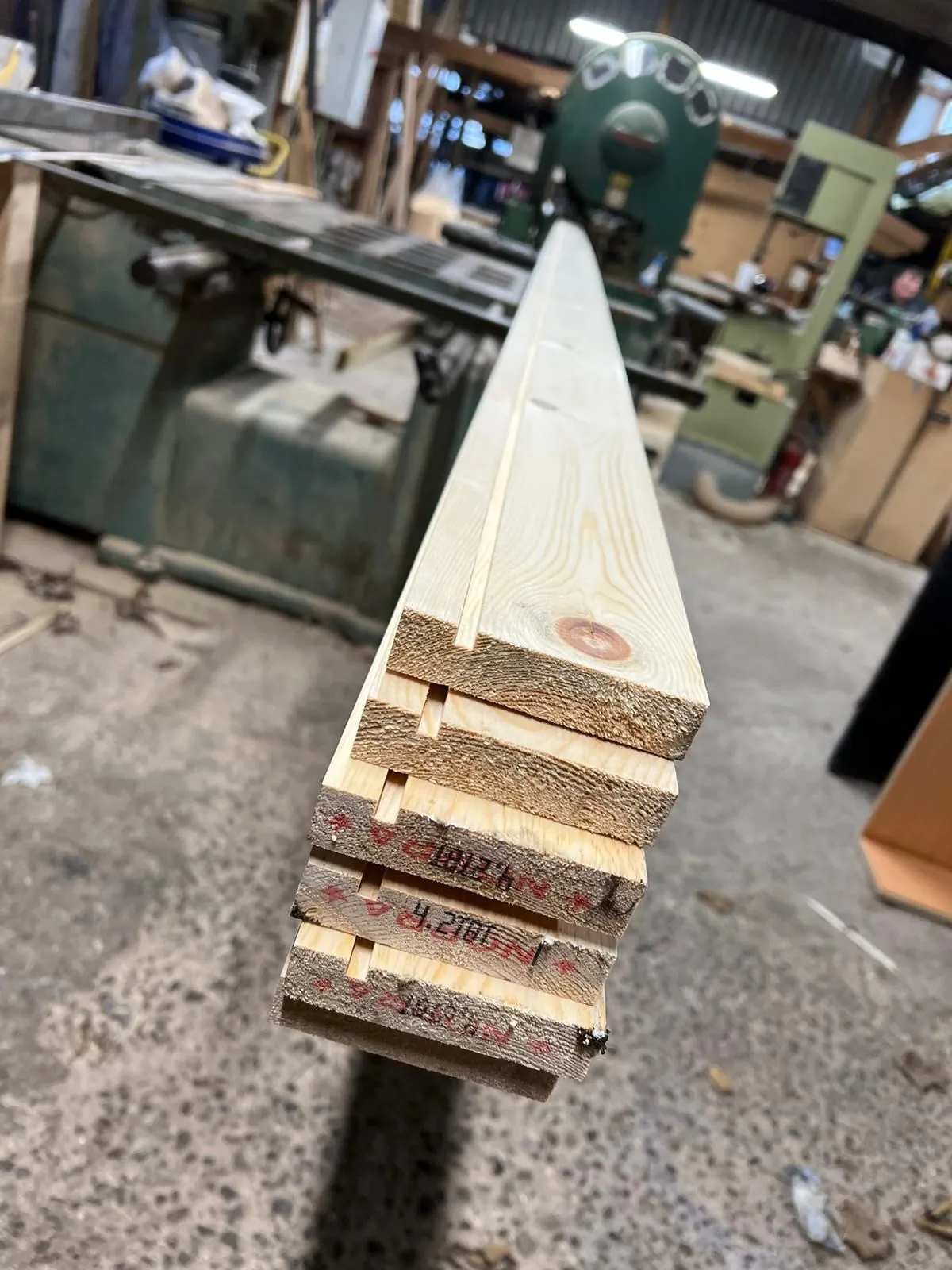 Freshly sawn timber boards marked with their measurements
